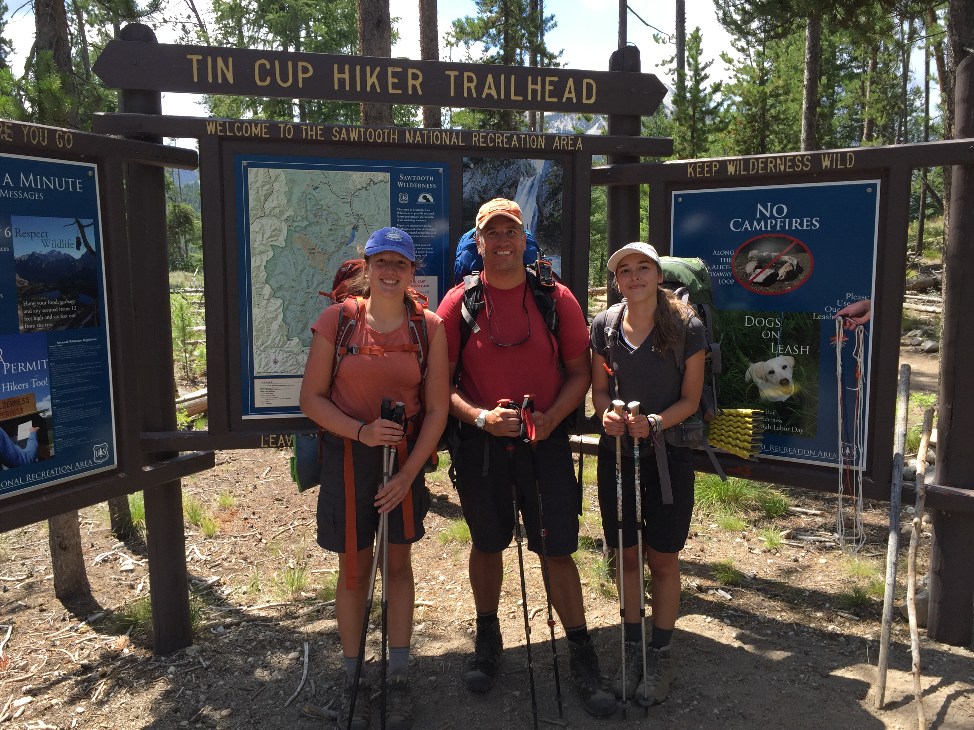 Group at the Tin Cup Hiker Trailhead sign at Pettit Lake